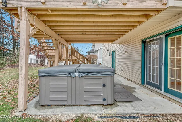 a view of a house with a wooden deck
