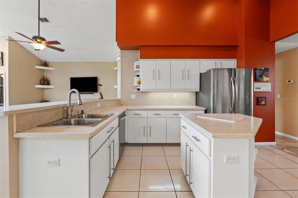14122 Newcastle Avenue Spring Hill, FL 34609 - Photo 20 of 66 a kitchen with a sink stove and cabinets