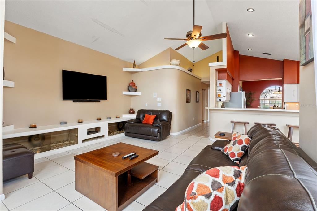 14122 Newcastle Avenue Spring Hill, FL 34609 - Photo 28 of 66 a living room with furniture and a flat screen tv