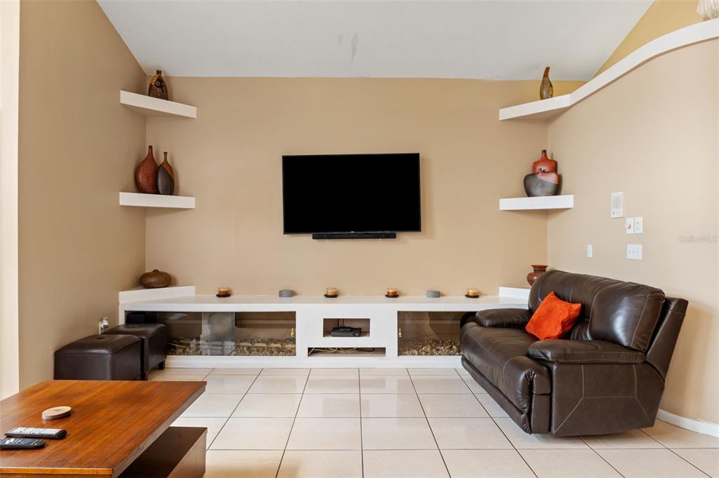 14122 Newcastle Avenue Spring Hill, FL 34609 - Photo 29 of 66 a living room with furniture and a flat screen tv