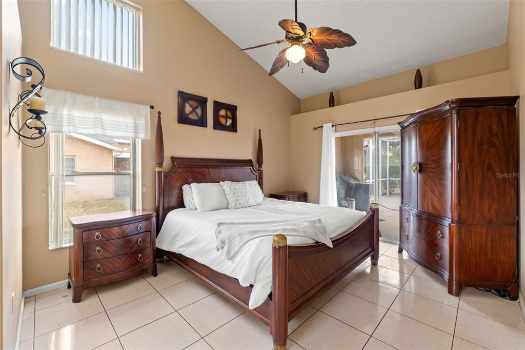 14122 Newcastle Avenue Spring Hill, FL 34609 - Photo 41 of 66 a large bed sitting in a bedroom next to a window
