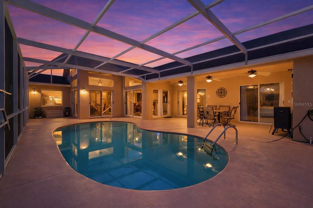14122 Newcastle Avenue Spring Hill, FL 34609 - Photo 5 of 66 a view of a swimming pool with a patio