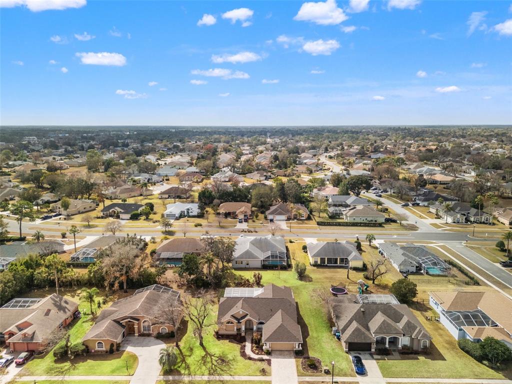 14122 Newcastle Avenue Spring Hill, FL 34609 - Photo 7 of 66 an aerial view of residential houses with outdoor space
