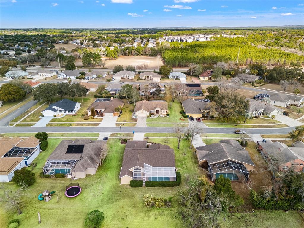 14122 Newcastle Avenue Spring Hill, FL 34609 - Photo 8 of 66 an aerial view of residential houses with outdoor space and swimming pool