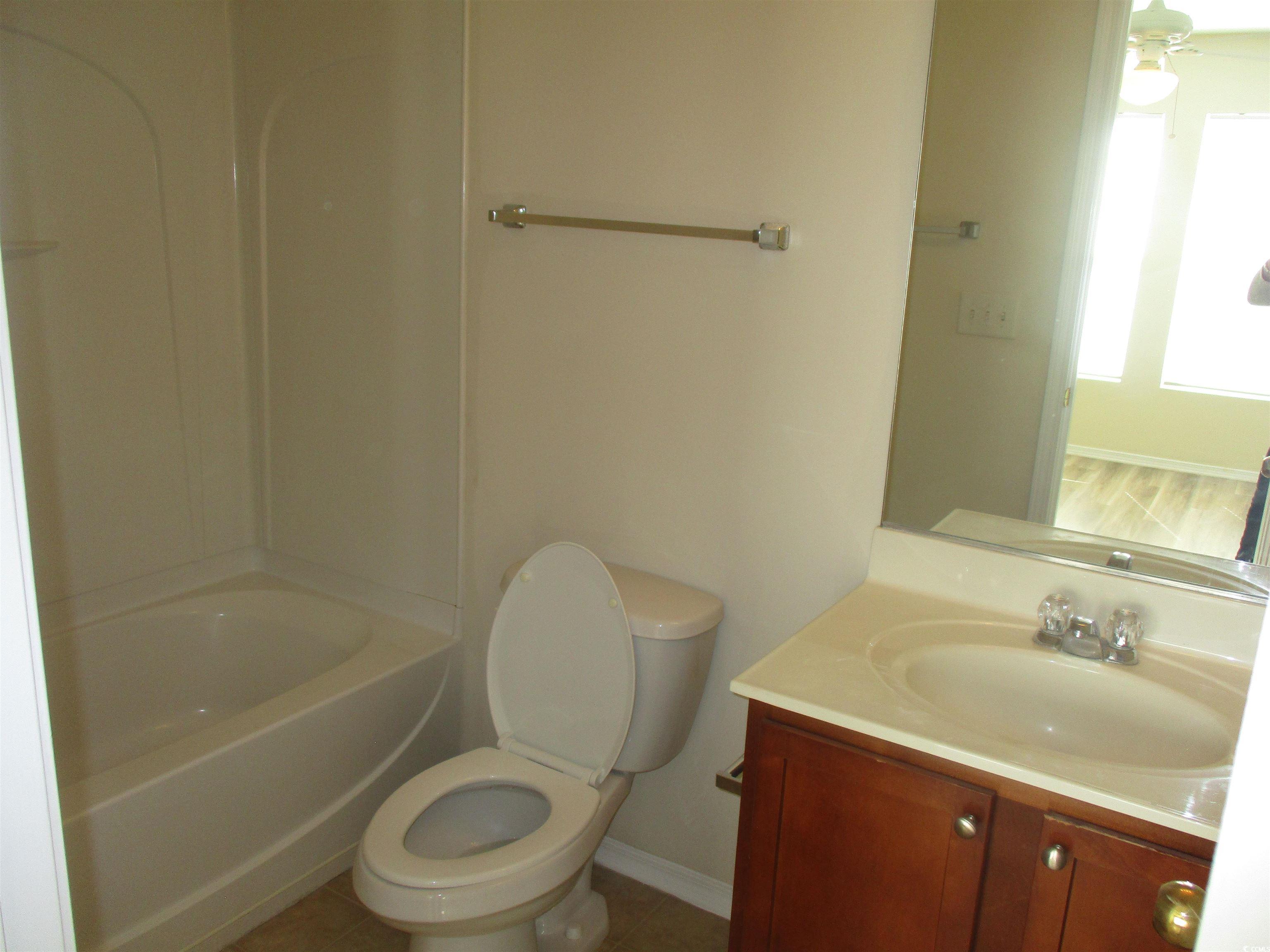 161 Olde Towne Way Myrtle Beach, SC 29588 - Photo 19 of 25 Full bathroom with vanity, tile patterned flooring, and shower / bath combination