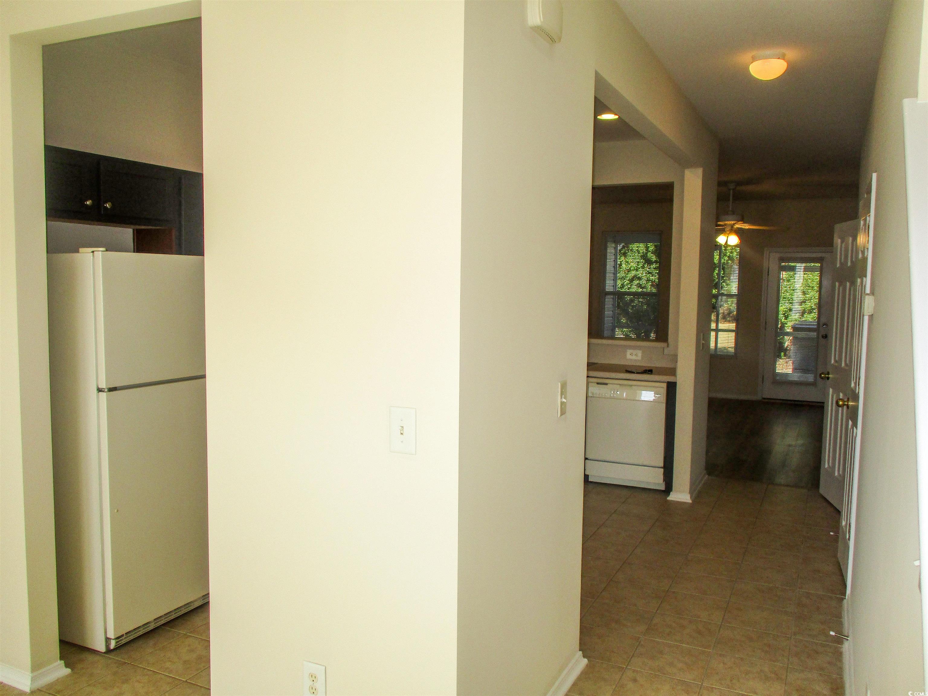 161 Olde Towne Way Myrtle Beach, SC 29588 - Photo 2 of 25 Corridor with light tile patterned floors and baseboards