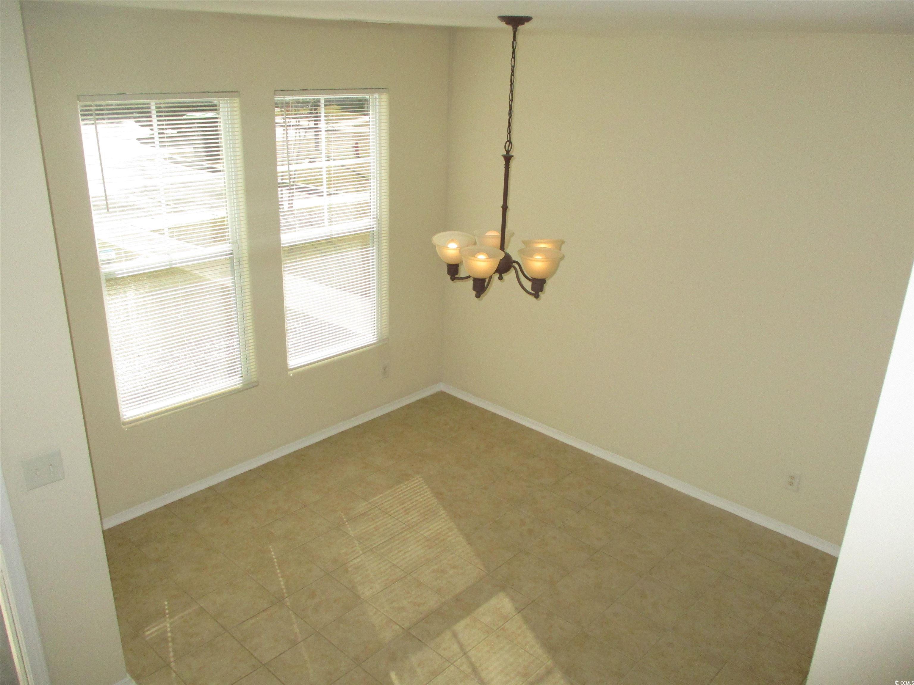 161 Olde Towne Way Myrtle Beach, SC 29588 - Photo 23 of 25 Unfurnished dining area with a chandelier and baseboards