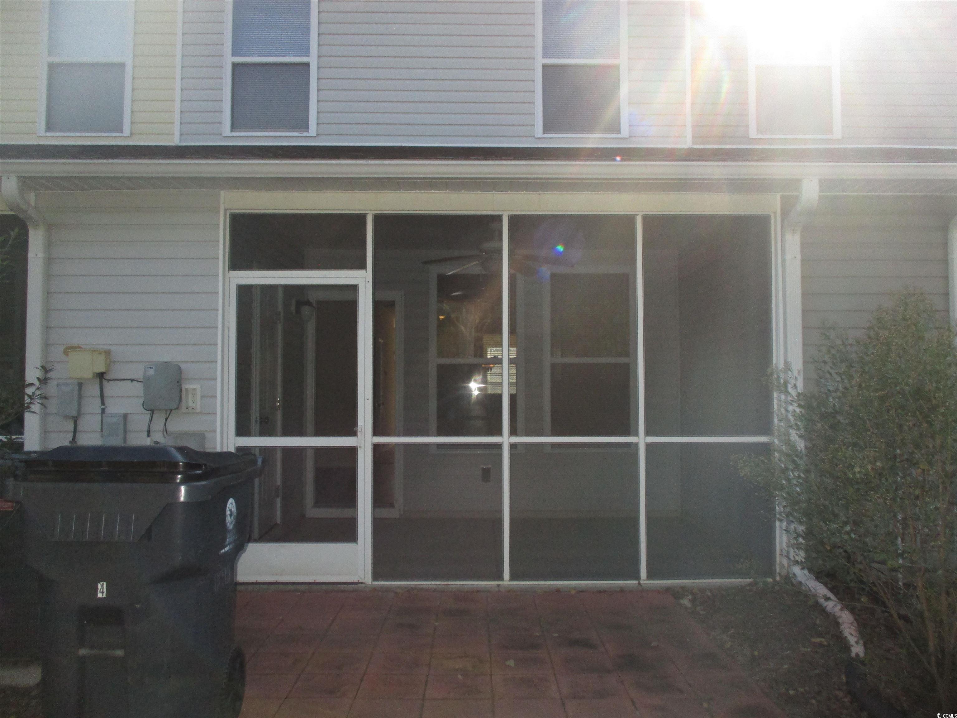 161 Olde Towne Way Myrtle Beach, SC 29588 - Photo 9 of 25 Rear view of house featuring a sunroom