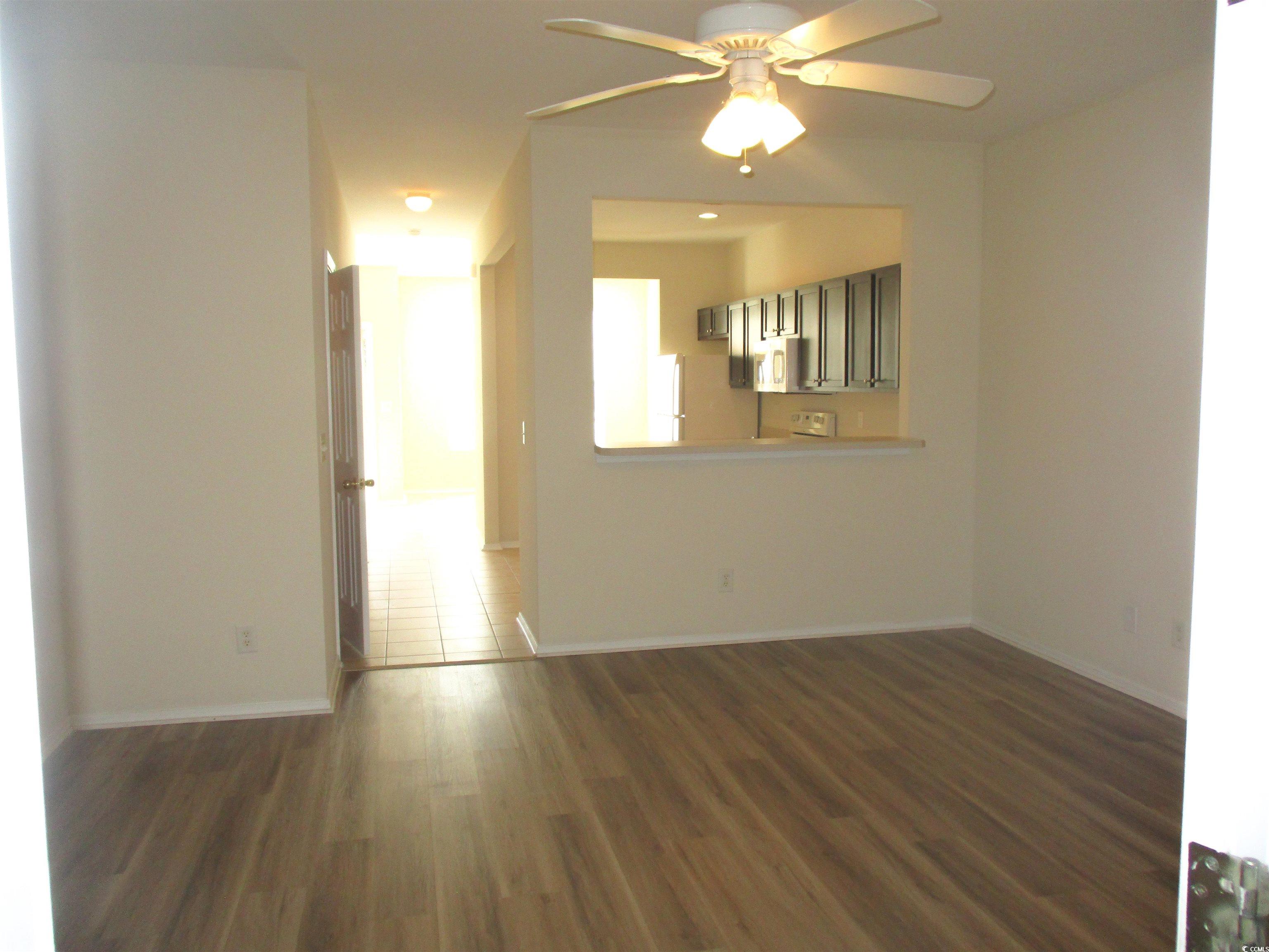 161 Olde Towne Way Myrtle Beach, SC 29588 - Photo 10 of 25 Unfurnished room with dark wood-style floors and a ceiling fan