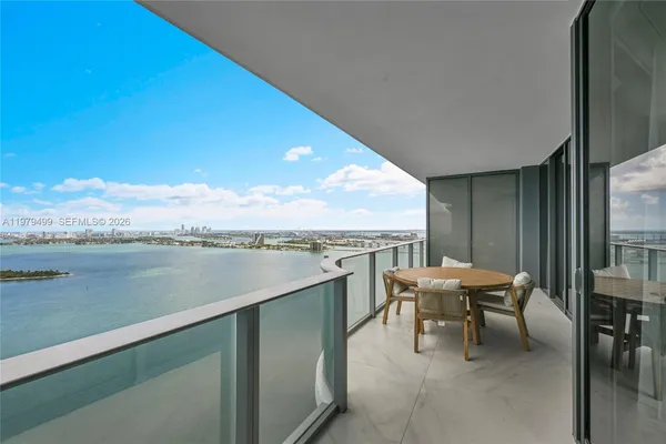 a terrace with outdoor seating and water view