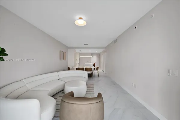a living room with furniture and a table