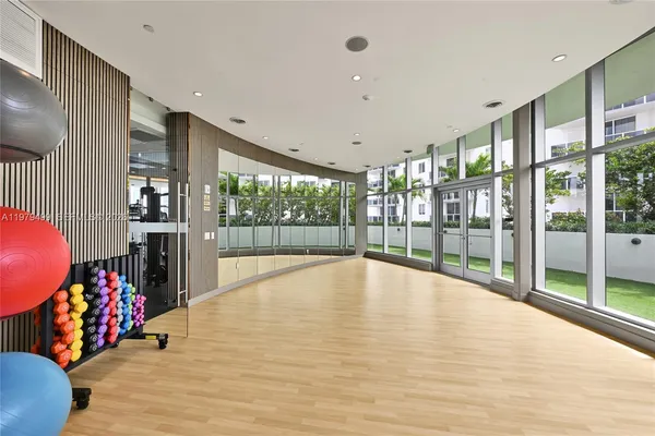 a view of an entryway with wooden floor