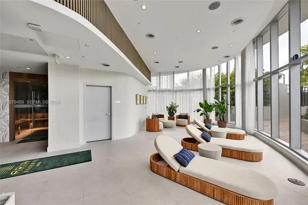 a living room with furniture and a window