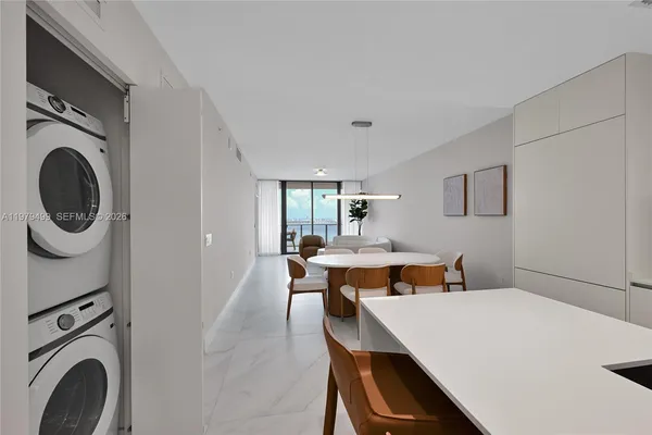 a dining room with a table and chairs