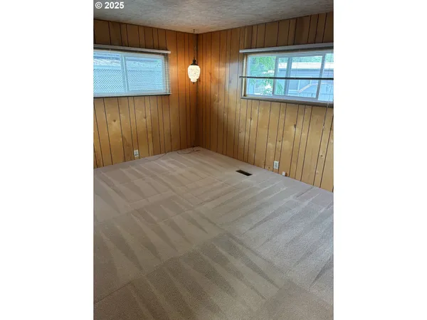 a view of a room with wooden door