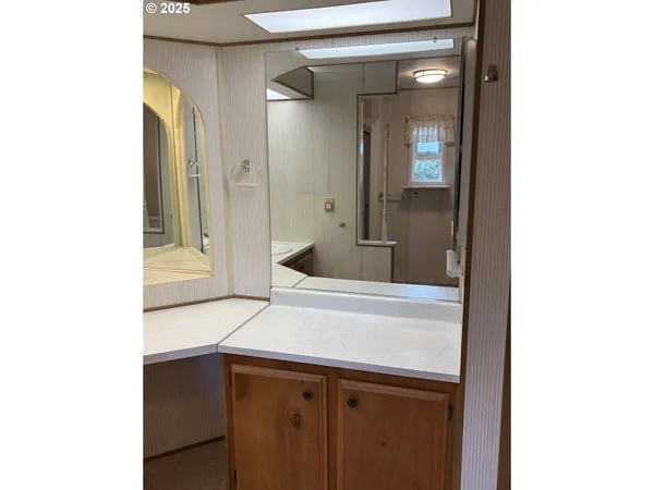 a bathroom with a glass shower door