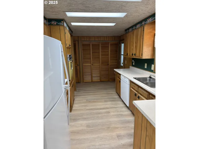 a view of a kitchen with a sink
