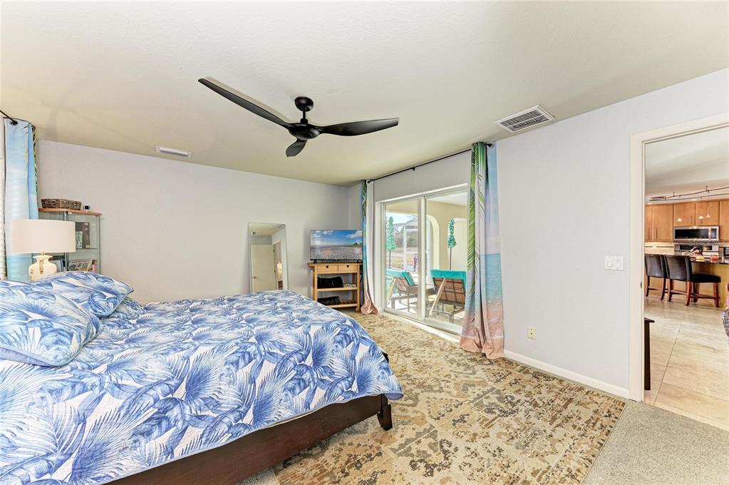 258 Surinam Street Punta Gorda, FL 33983 - Photo 21 of 47 a bedroom with a large bed and a window