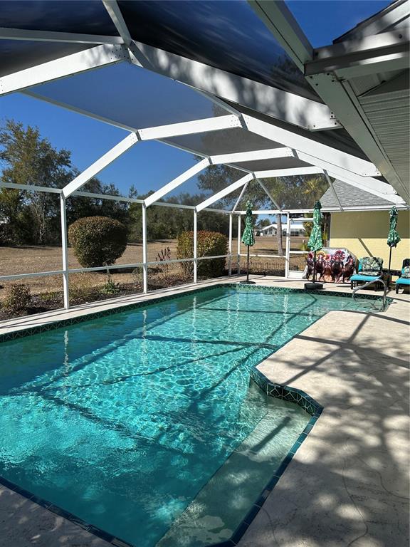 258 Surinam Street Punta Gorda, FL 33983 - Photo 35 of 47 a view of a backyard with sitting area