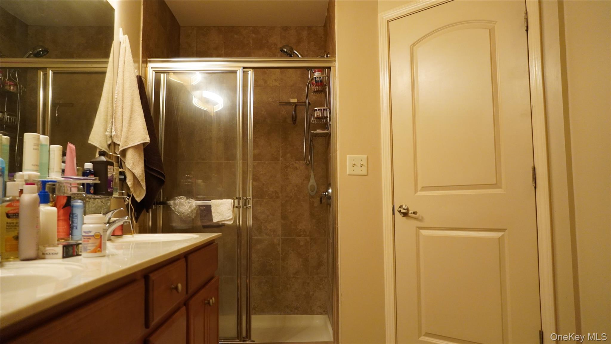 1402 Hawthorn Way New Windsor, NY 12553 - Photo 18 of 25 a bathroom with a sink and a mirror