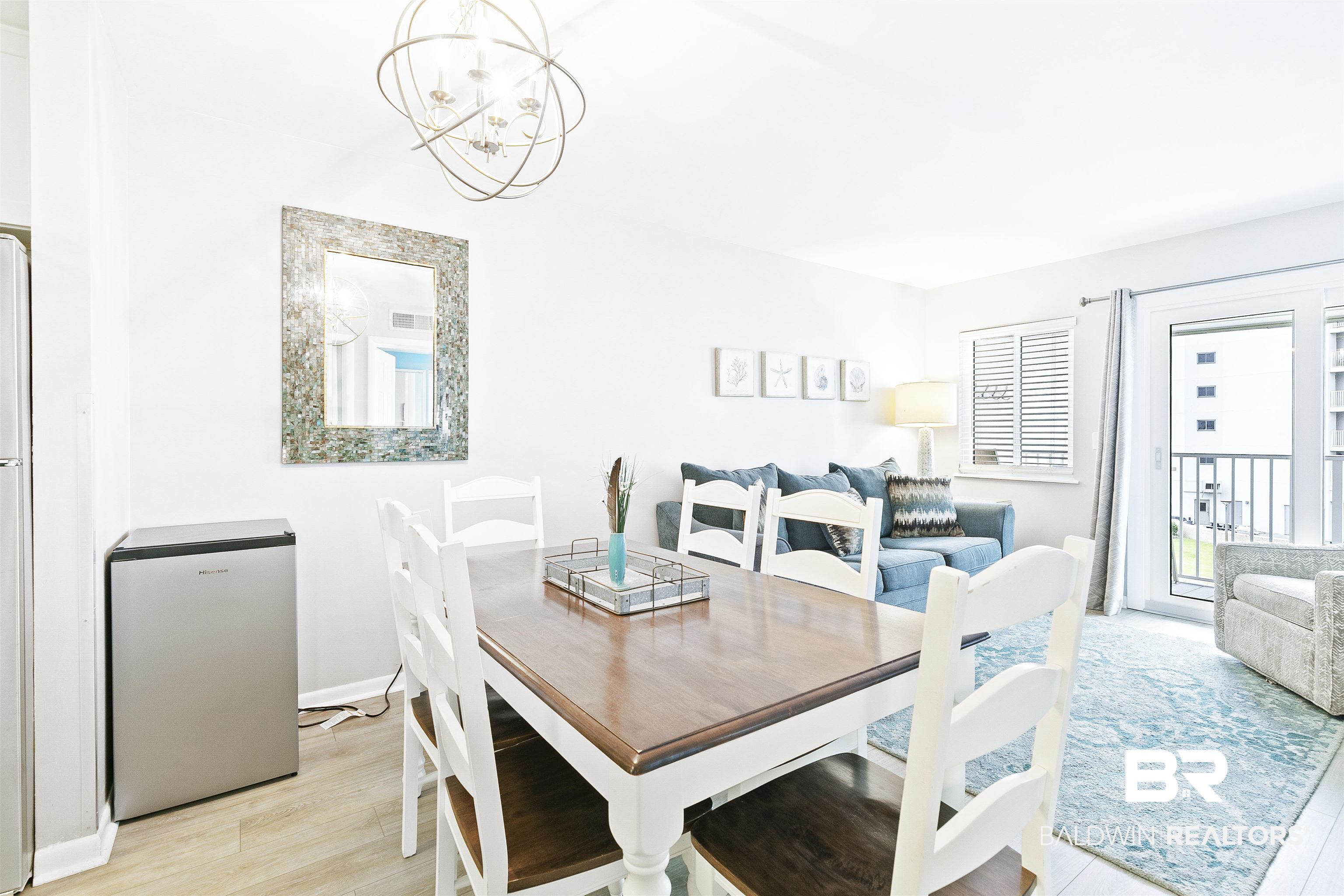 400 Plantation Road, Unit 3314 Gulf Shores, AL 36542 - Photo 10 of 47 Dining area with a notable chandelier and light wood-type flooring