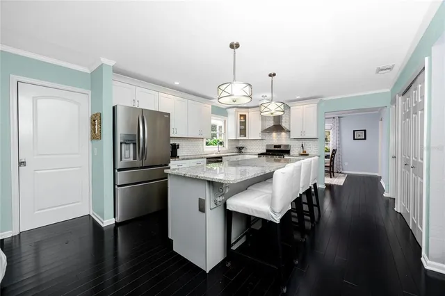 a living room with furniture and windows