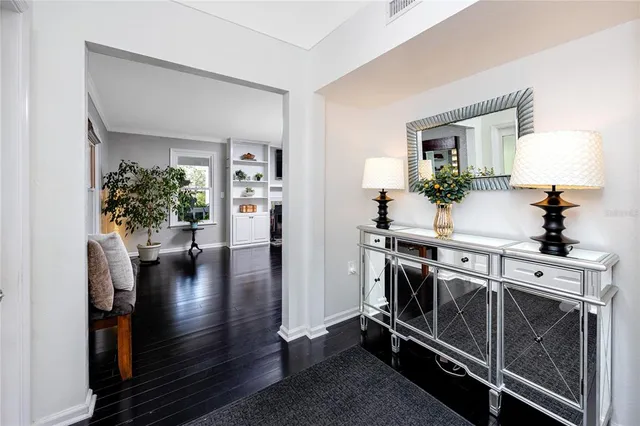 a front view of house with yard and trees in the background