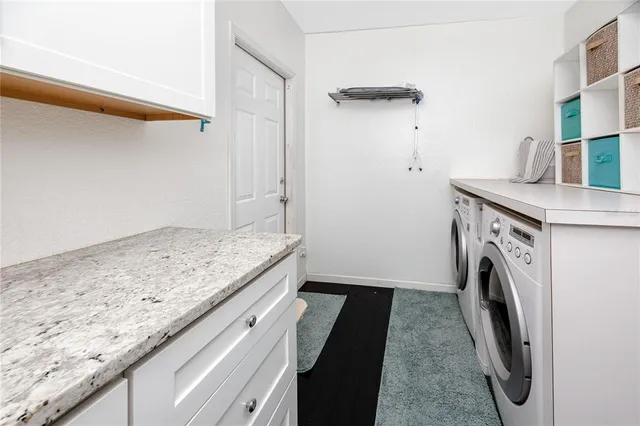 a white refrigerator freezer sitting inside of a kitchen