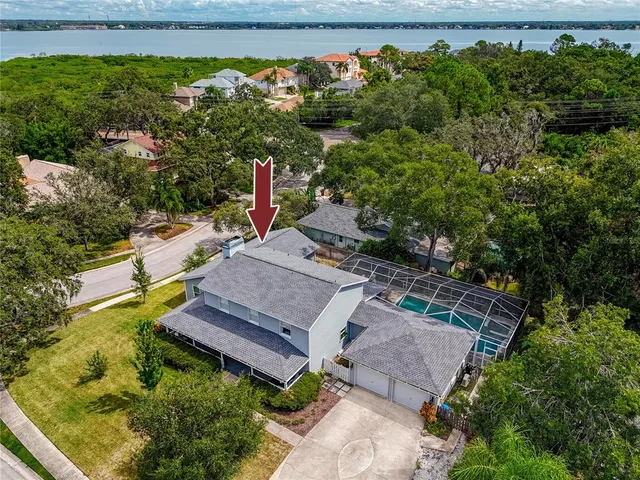 an aerial view of a house with a yard