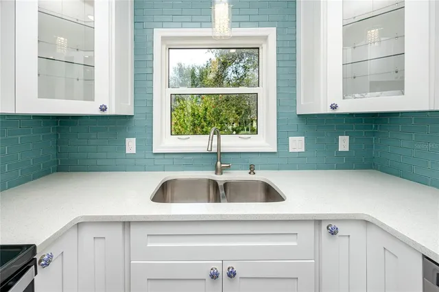 a bathroom with a toilet a sink and a mirror