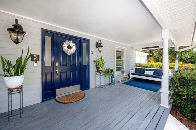 a view of a room with furniture and wooden floor