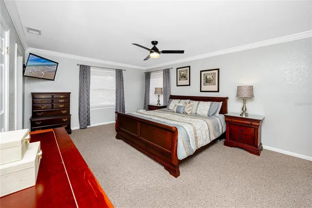 a living room with hardwood floor to ceiling window and wooden floor
