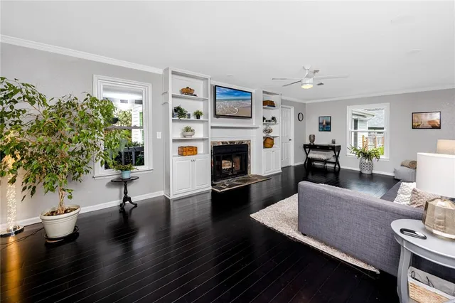 a living room with furniture and a fireplace