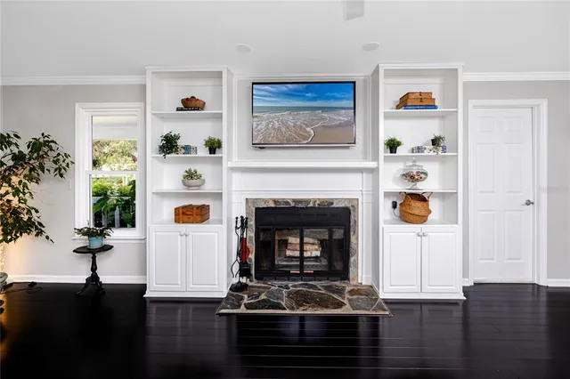 a kitchen with stainless steel appliances granite countertop a stove a sink dishwasher a microwave oven with a dining table and chairs