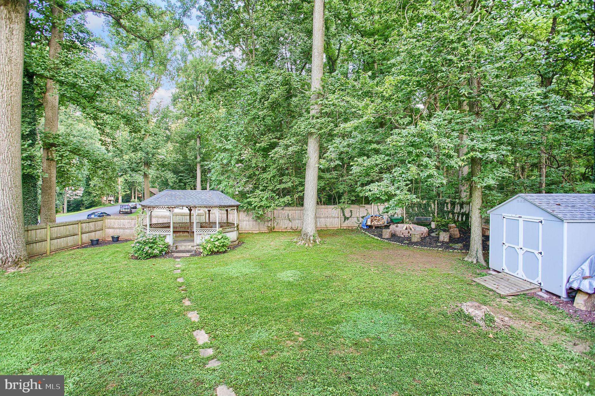 687 Amosite Road Elizabethtown, PA 17022 - Photo 26 of 29 Back yard with gazebo, fire pit area, and shed