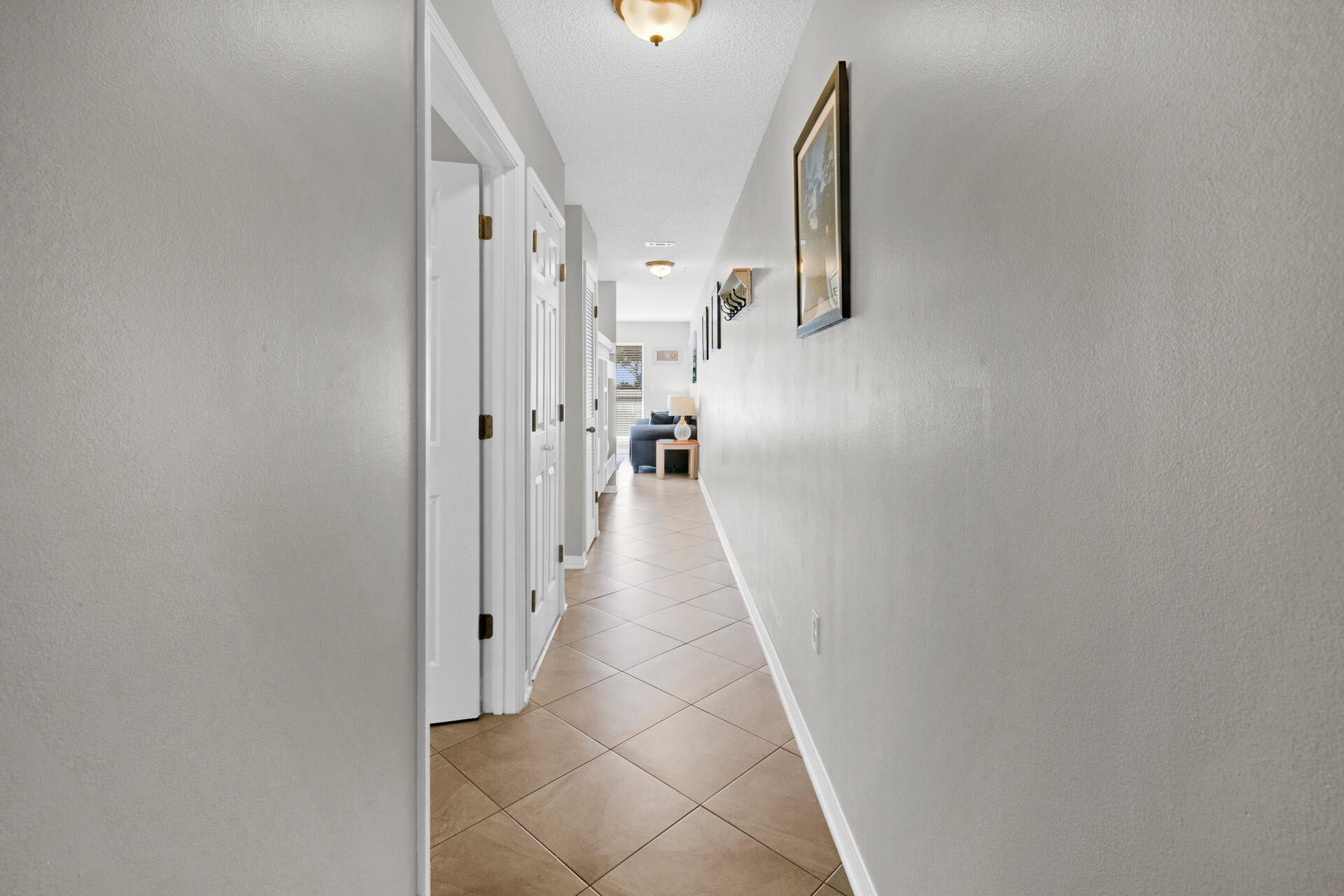144 Spires Lane, Unit 110 Santa Rosa Beach, FL 32459 - Photo 20 of 33 a view of a hallway with windows
