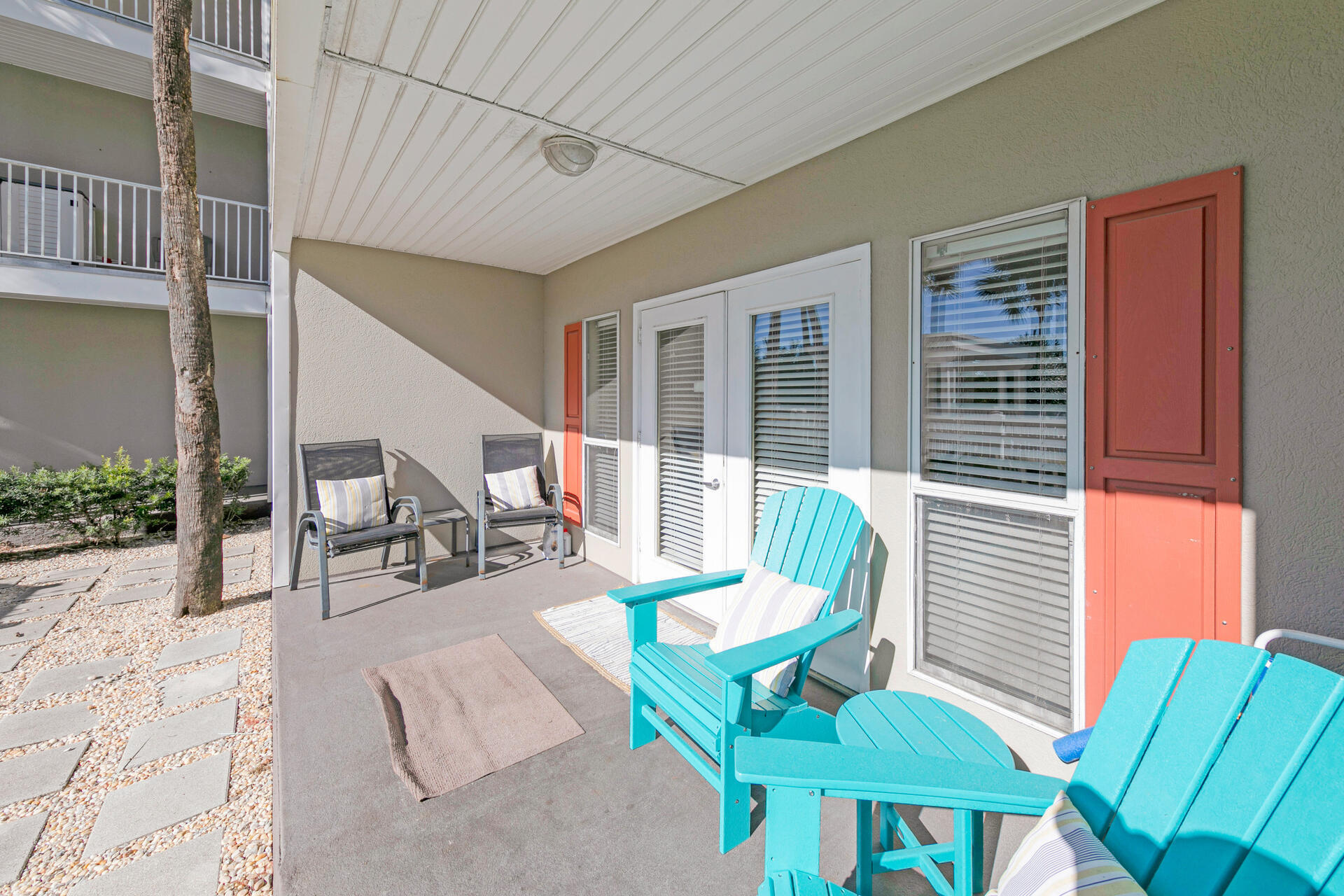 144 Spires Lane, Unit 110 Santa Rosa Beach, FL 32459 - Photo 22 of 33 a view of a patio with a dining table and chairs