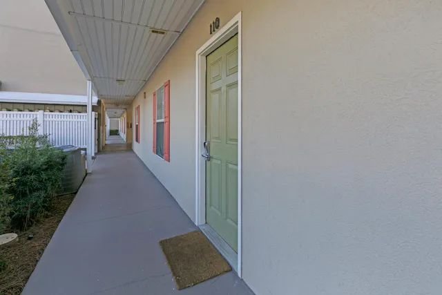 a view of a swimming pool with an outdoor space and seating area