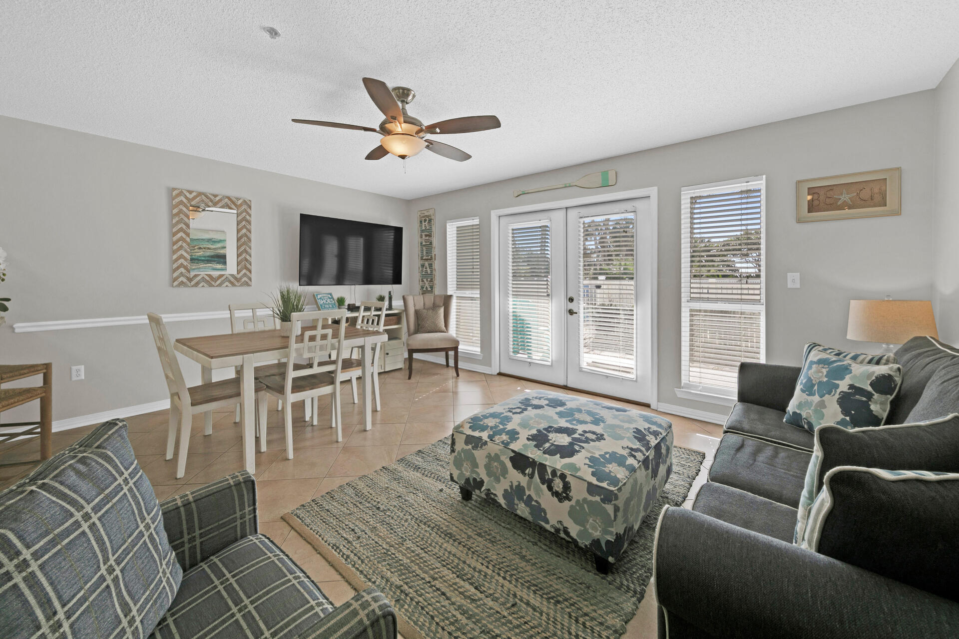 144 Spires Lane, Unit 110 Santa Rosa Beach, FL 32459 - Photo 4 of 33 a living room with furniture and a flat screen tv