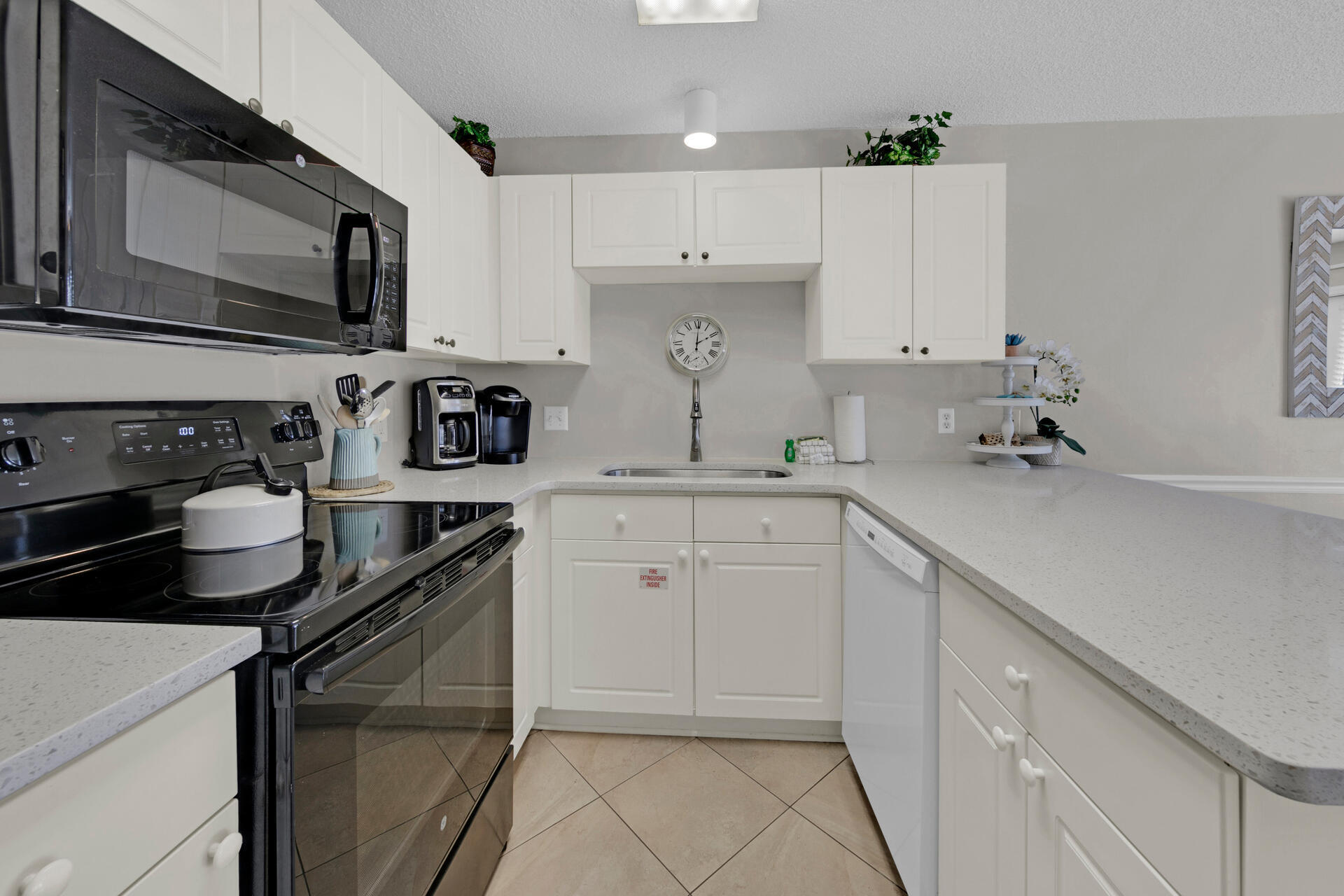 144 Spires Lane, Unit 110 Santa Rosa Beach, FL 32459 - Photo 9 of 33 a kitchen with stainless steel appliances a sink a stove and cabinets