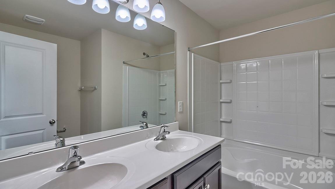109 Piney Wds Road Fletcher, NC 28732 - Photo 16 of 28 a bathroom with a sink and a mirror