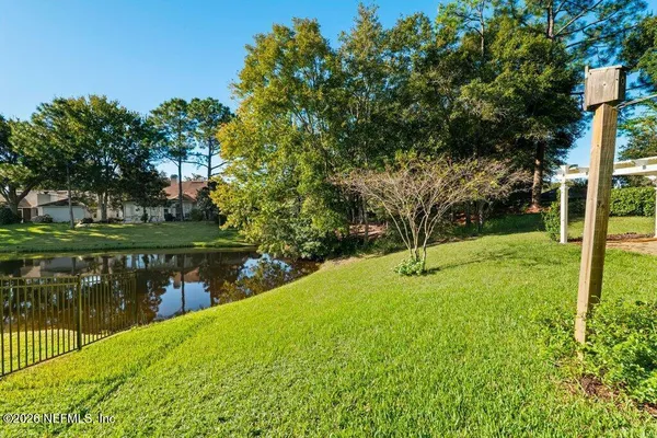 a view of a lake with a garden
