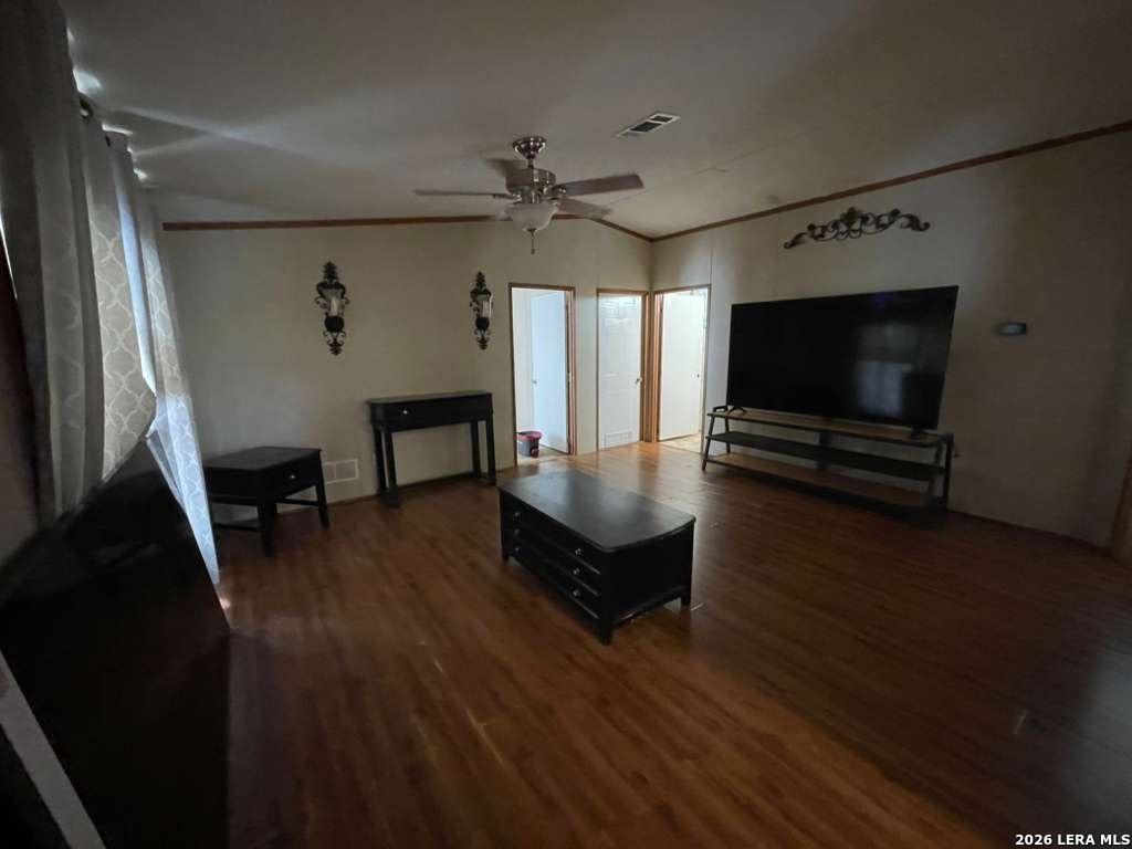 311 East Frio Street Dilley, TX 78017 - Photo 8 of 24 a living room with furniture and a flat screen tv