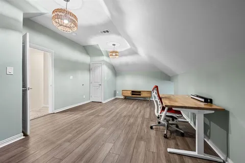 a view of a livingroom with wooden floor