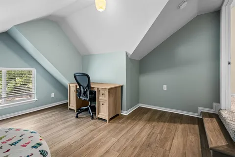 a living room with a couch and a window
