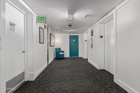 a swimming pool with an outdoor seating and a garden