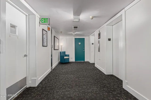 a swimming pool with an outdoor seating and a garden