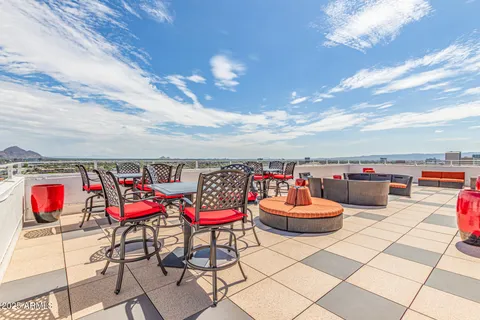 a view of a garden with a building in the background