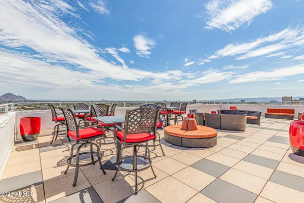 a view of a garden with a building in the background