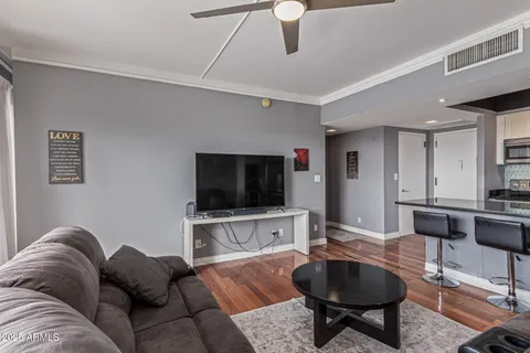 a living room with furniture and a flat screen tv